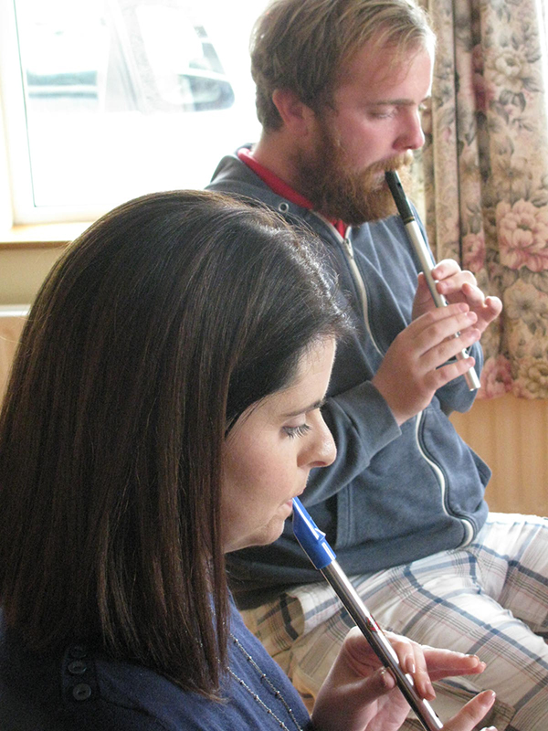 Playing the tin whistle.