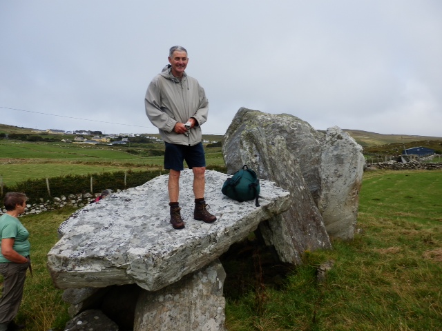 Tony Birtill, one of our experienced guides, standing on a dolmen.